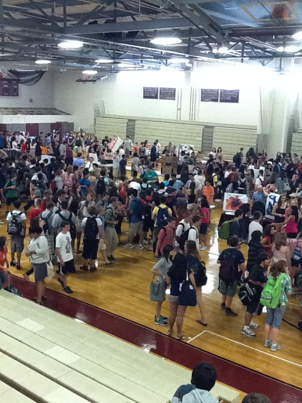 The freshman class wandered the gym exploring new interests for the coming year