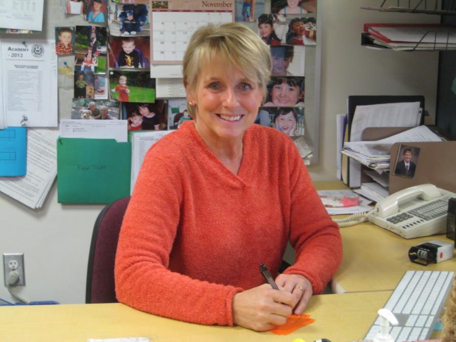 Secretary Linda Mahoney at her desk