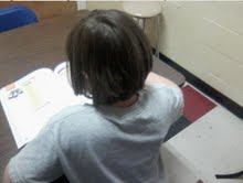 A 4th grade student working on their homework at Abbot Elementary.