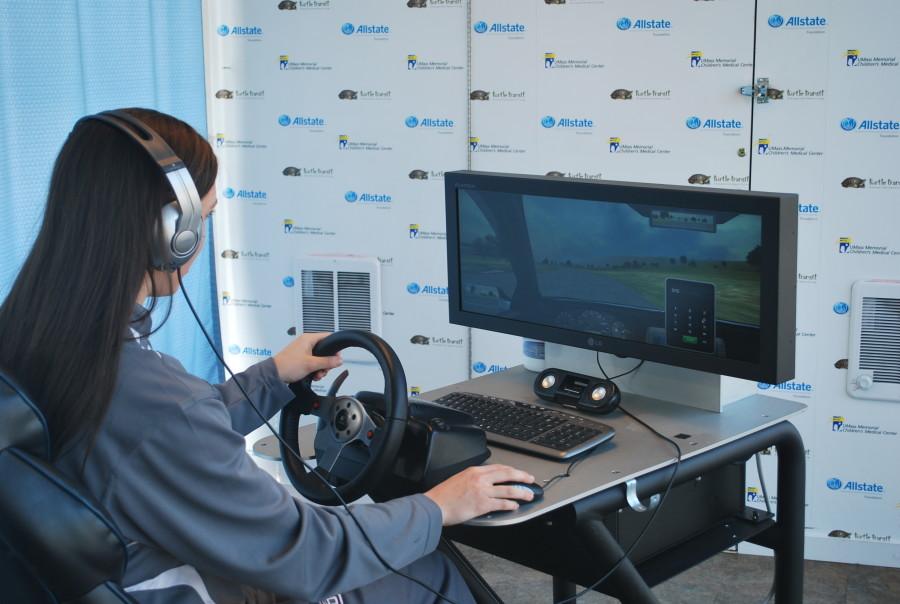 Senior Anna Collins tests out the driving simulator.
