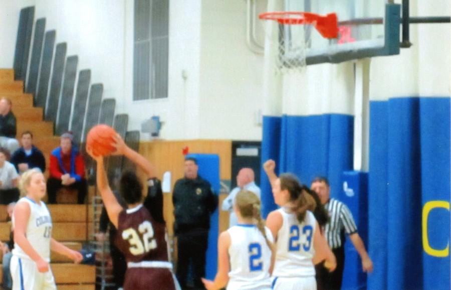 Madeline Russell is about to make a basket.