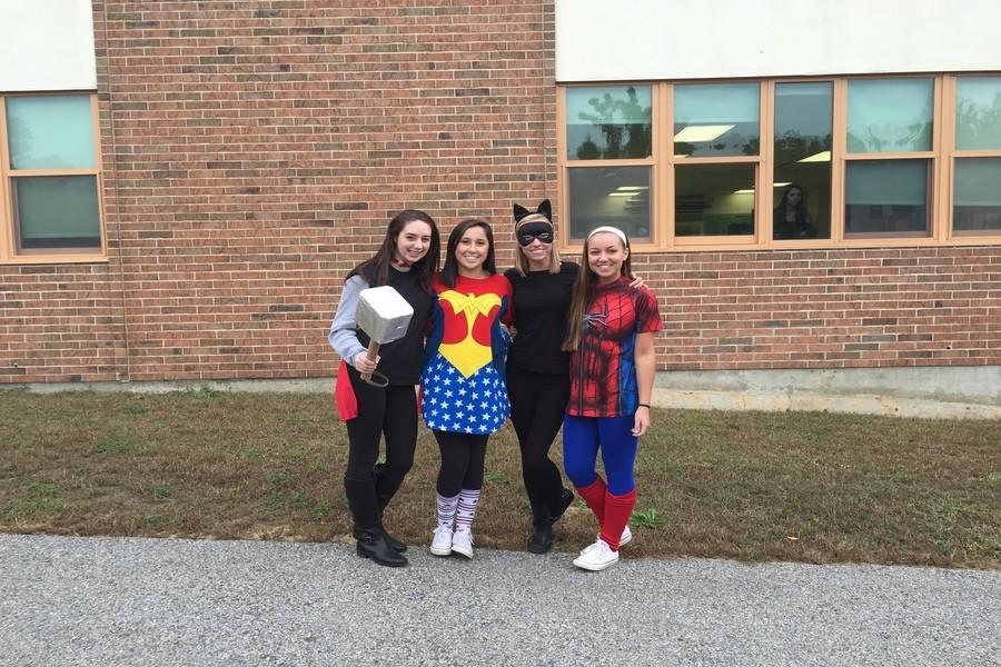 (From left to right) Seniors Emily Graziani, Hannah Chateauneuf, Catherine Grondine, and Bridget Gomes represent their inner superheroes with their spirit for the day, as their super strength shone on the court during the game. 
