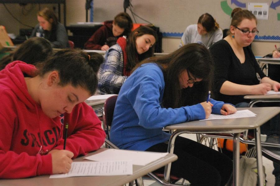 Students take a test in class.