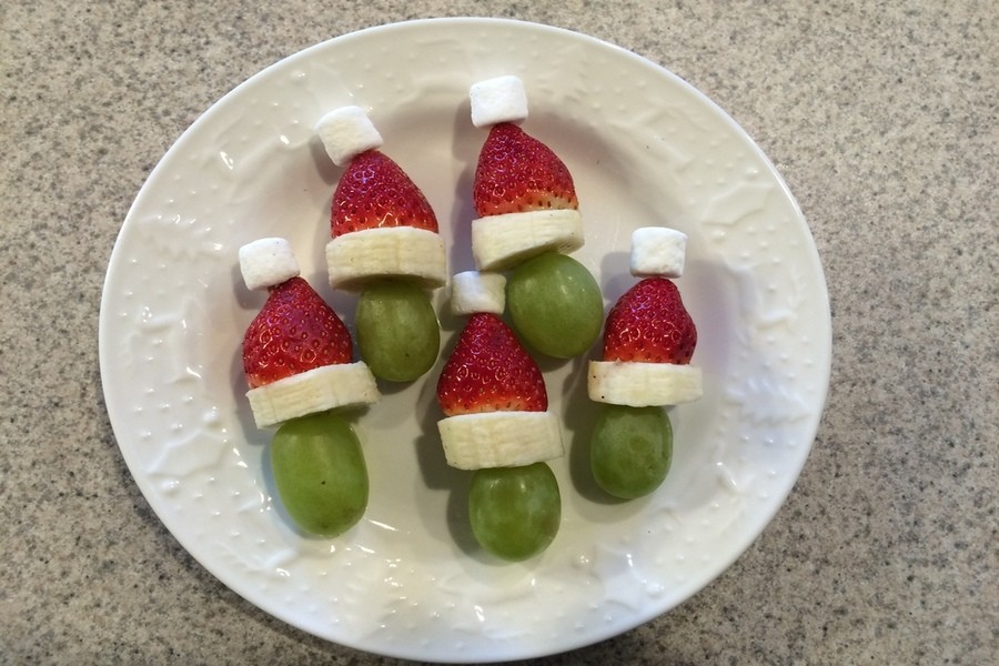 Green grape, banana, strawberry, and mini marshmallow holiday Grinches.