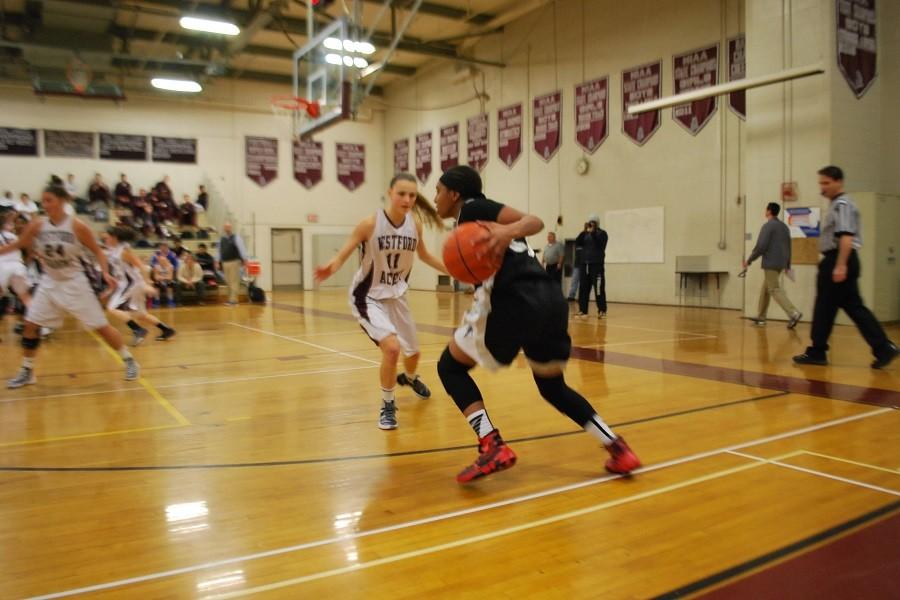 Libby guards a player in a previous game against Cambridge