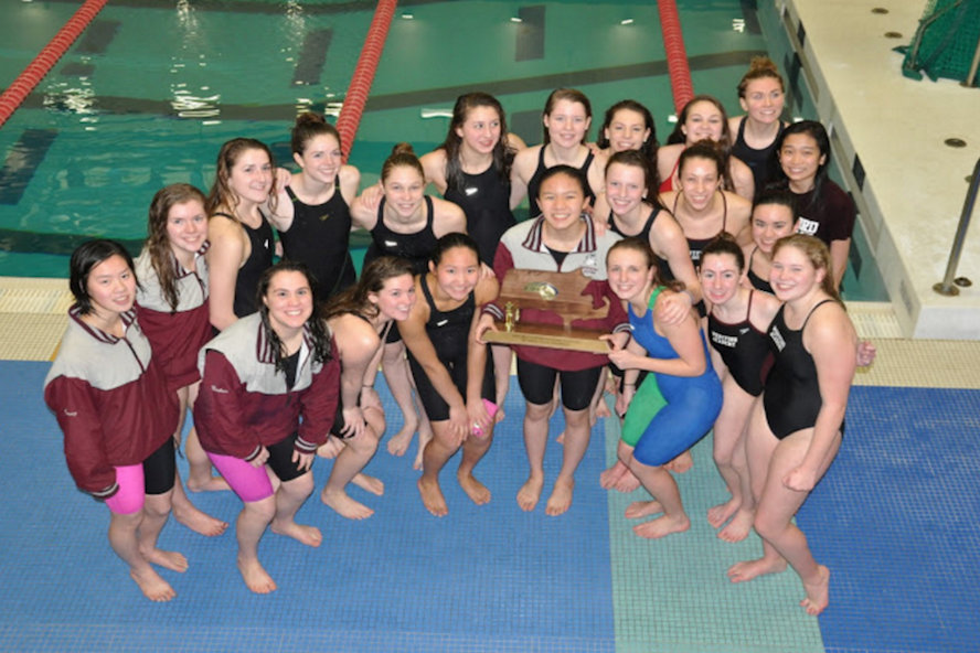 The+Girls+Varsity+Swimming+and+Diving+team+posing+after+MIAA+State+Championships.+