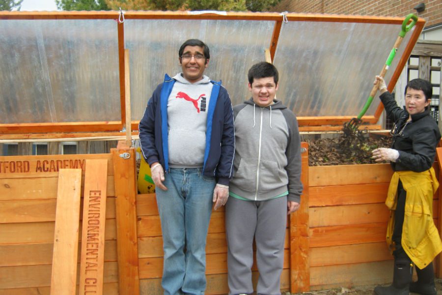 Life Skills students Arun and Zach in front of the compost.