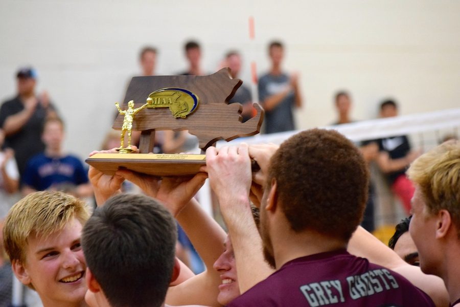 WA Boys Varsity Volleyball team holding their trophy after winning the North Division  One Championships.