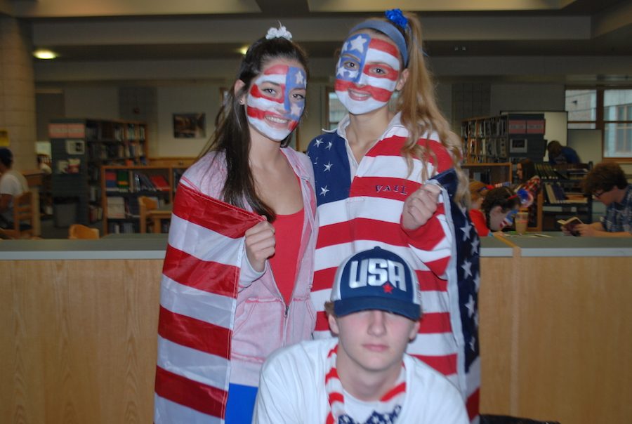Seniors Sam Walter, Amanda Smith, and James Flory go all out with face paint and American flags.