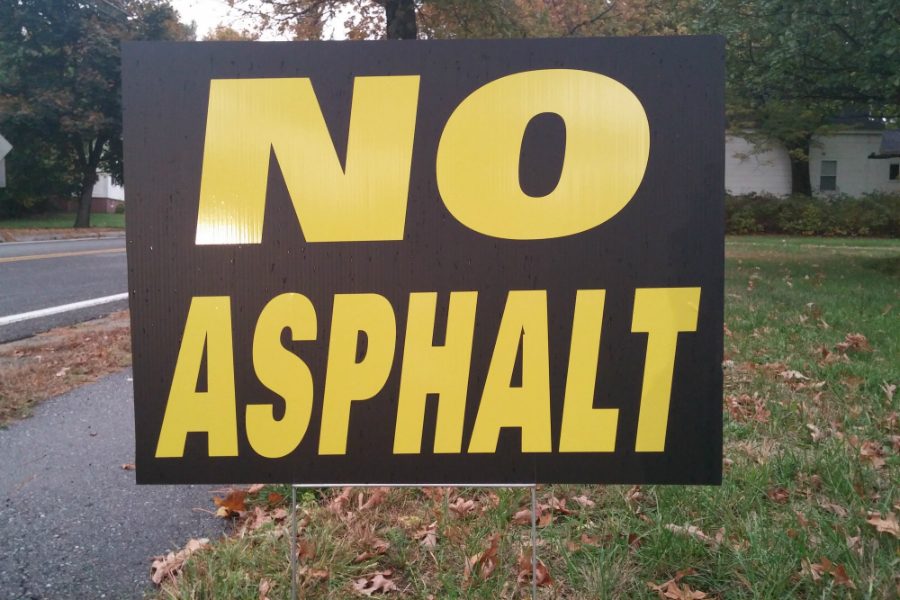 a no asphalt sign, displayed on a Depot St. front yard