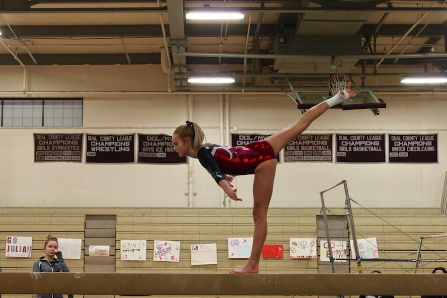 Freshman Olivia Donahue on beam