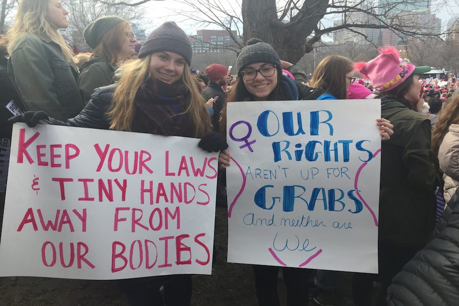 Two women at the Boston Womens Rights March protesting for their rights.