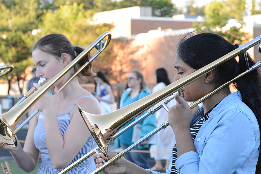 Freshman Lasya Dutta plays the trombone during the marching band performance.