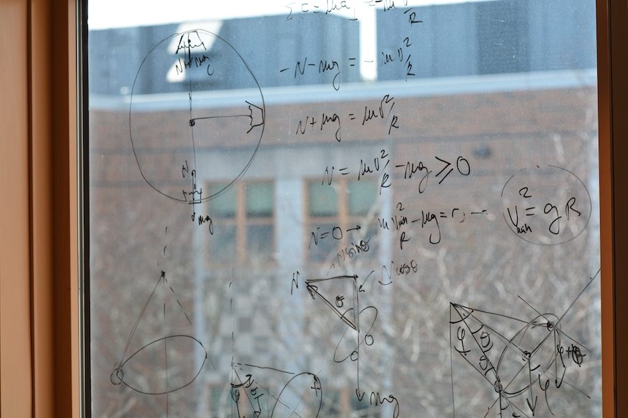 Physics instruction spreads from the whiteboard to the windows.