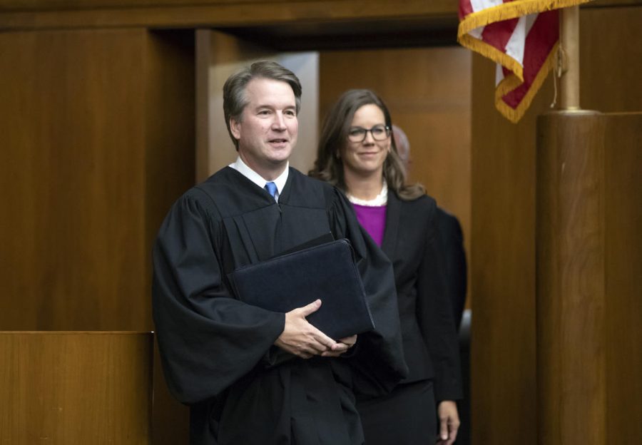 President Donald Trumps Supreme Court nominee, Judge Brett Kavanaugh, officiates at the swearing-in of Judge Britt Grant, right, to take a seat on the U.S. Court of Appeals for the Eleventh Circuit, Tuesday, Aug. 7, 2018, at the U.S. District Courthouse in Washington. (AP Photo/J. Scott Applewhite)