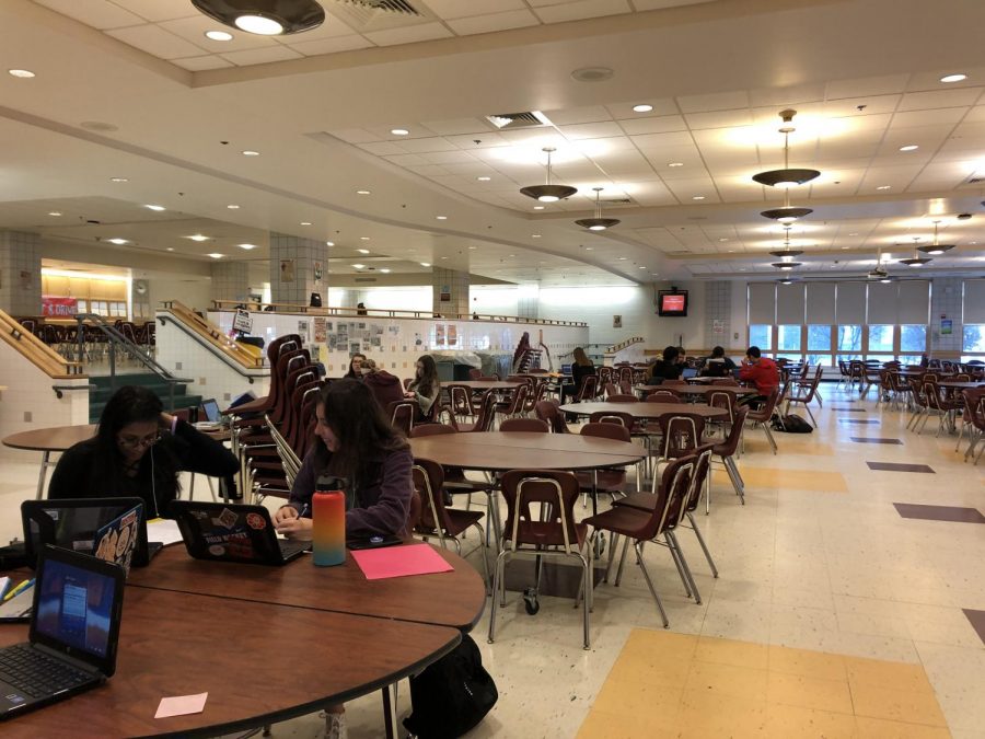 Students in the cafe completing classwork. 