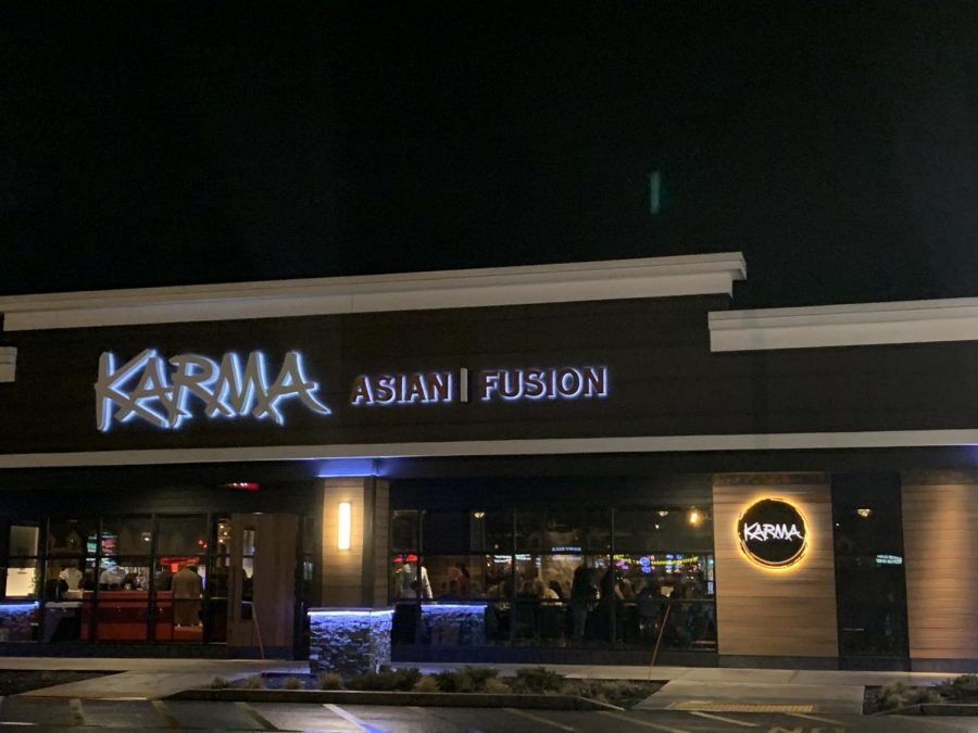 The exterior of Karma looks modern in the parking lot.