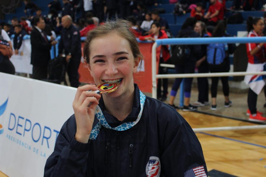 Victoria Princi bites down on her gold medal at the Pan-American tournament in Argentina. 