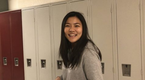 Lucy Xiao poses by lockers.