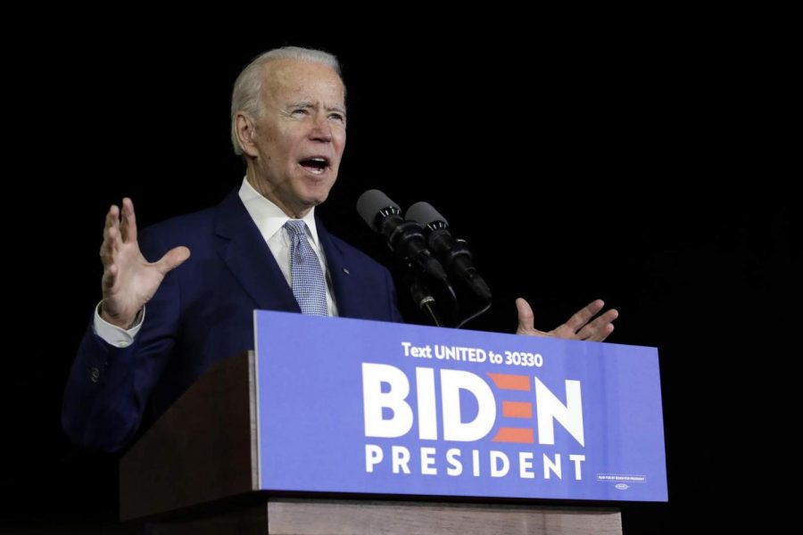 Joe Biden speaks behind a podium at one of his campaigns.