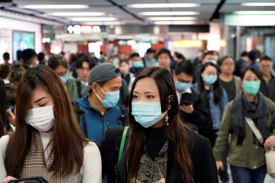 Passengers wear masks to protect themselves from the coronavirus in a subway station in Hong Kong