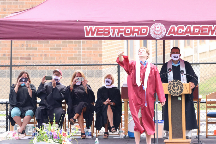 Class president Wasylyshyn throws graduation cap in the air