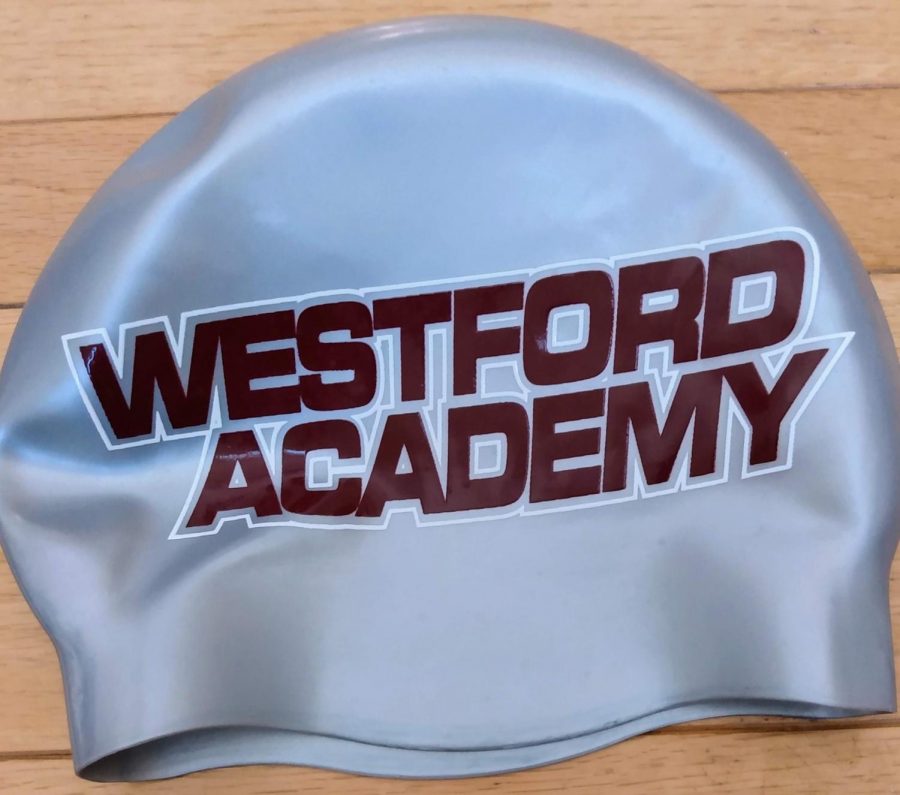 The teams swimming caps that freshman received this weekend.