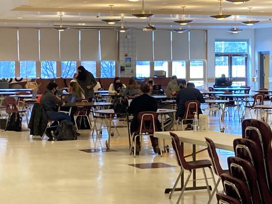 Students working in the cafeteria before the full return. What will the changes to classes look like when students return to the building on April 26?