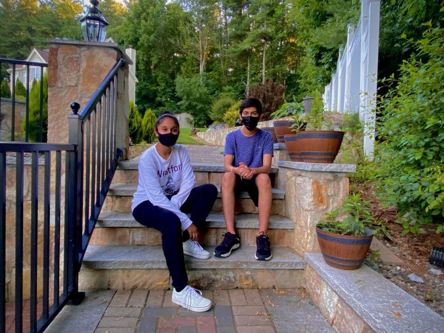 Abhinav Wadhwa and Muskan Bansal, two sophomores running the India Covid Relief Fundraiser, pose on some steps for a picture.