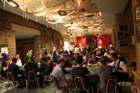 The Senior class of 2019 in the bell lobby playing poker during their Last Night event.