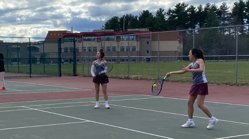Varsity Girls Tennis practices before game  against Andover at Stony Brook. The game ended in defeat for the Ghosts 4-1. 