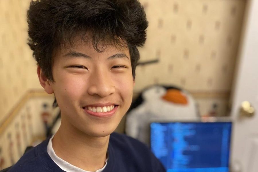 Justin Huang pictured coding on his computer.