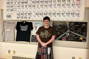 Casey Collins smiles for a picture in her chemistry classroom.
