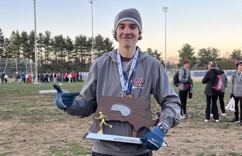 Paul Bergeron appears with the XC State Championship trophy minutes after his win.