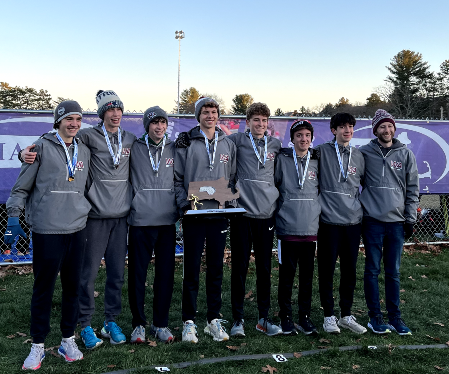 WA Boys Cross Country team lined up with their second place trophy from the MIAA States Meet on Saturday, November 19th, 2022 in Devens. The runners include, from the left, junior Paul Bergeron, sophomore Jack Graffeo, senior Austin DeSisto, senior Owen Shultz, junior Davis Haines, junior Adam Wedlake, sophomore Nathan Dubay and Coach Scott Hafferkamp.