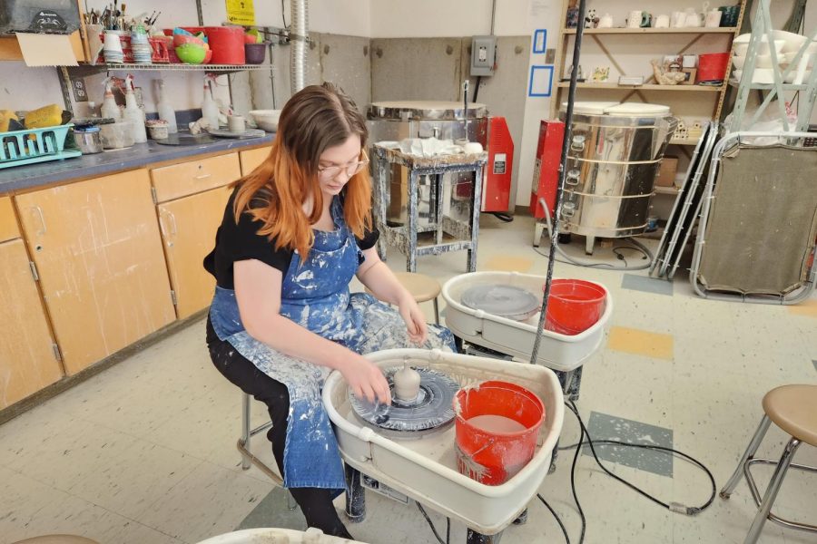 Scherini+sits+at+the+pottery+wheel%2C+getting+ready+for+her+Ceramics+class.