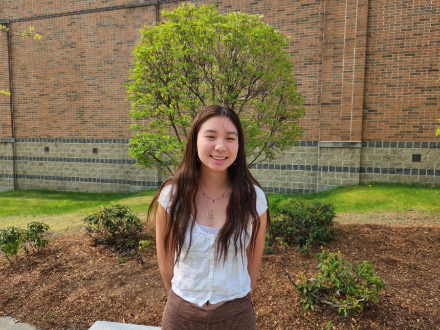 Chen, the class of 2023 valedictorian, smiles for a picture outside of WA.