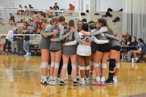 WA huddles up before the start of the first set.