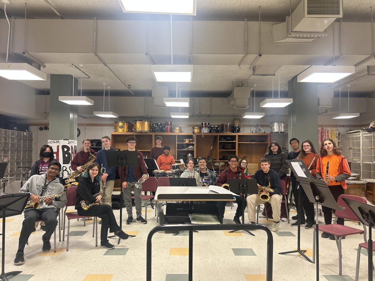 All 15 members of the new Salsa Band, along with Rodriguez and Engdahl, smile for the camera, instruments in hand, after a successful first meeting. 