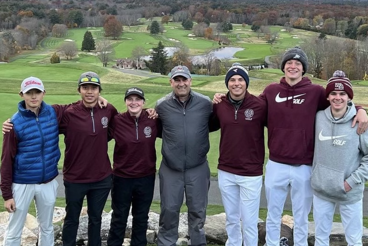 WA Golf smiles for the camera after coming in fifth place at the Massachusetts State Championship, with the beautiful GreatHorse Golf Course in the background.