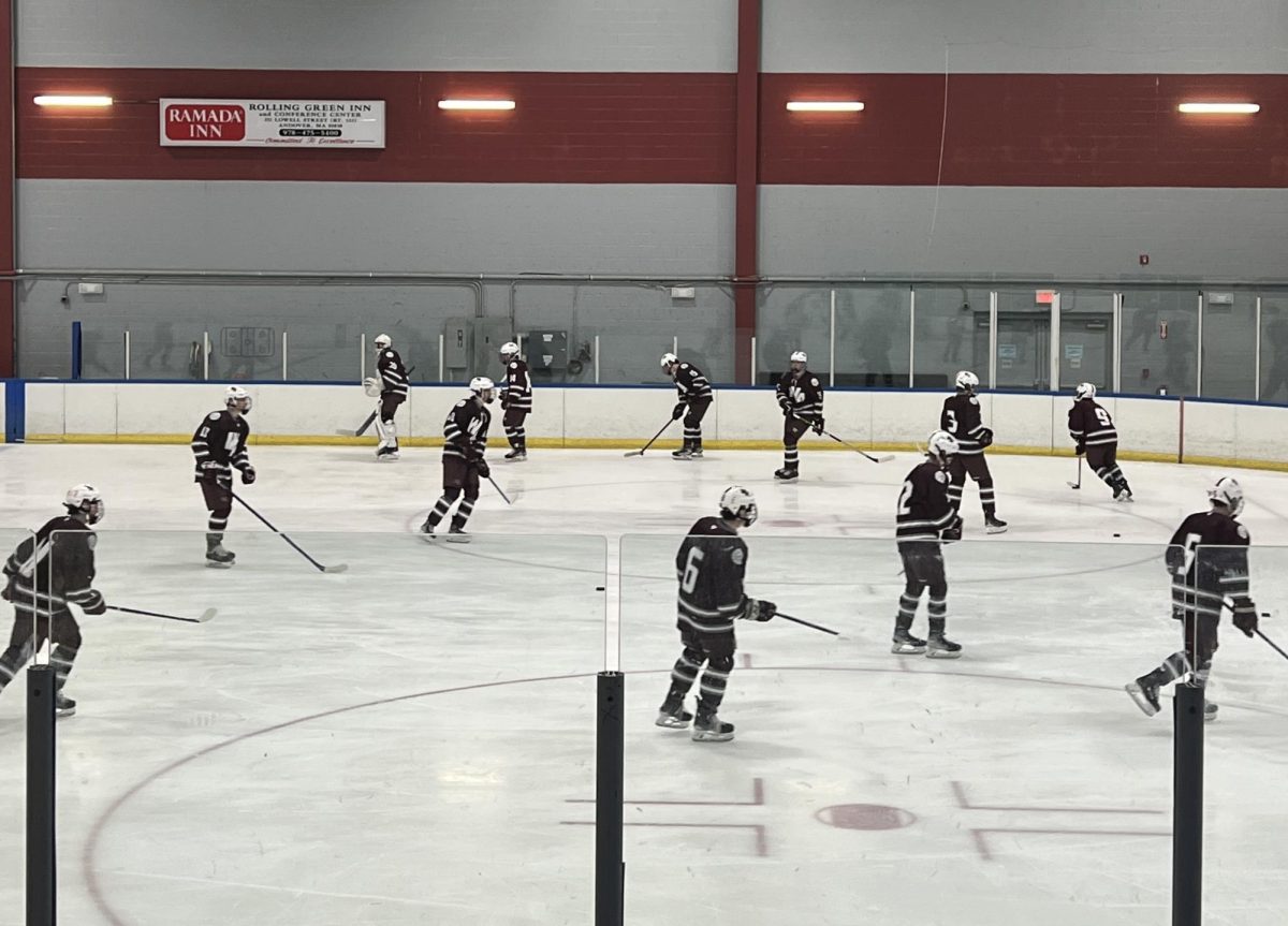 WA Boys Hockey warms up before their 1-0 loss to Central Catholic.