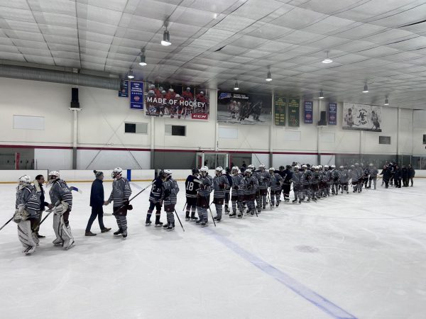 WA shakes hands with Lincoln-Sudbury after their win.