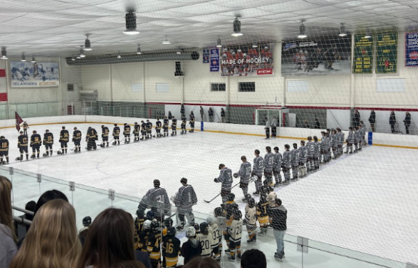WA and Andover line up for the National Anthem before the game. 