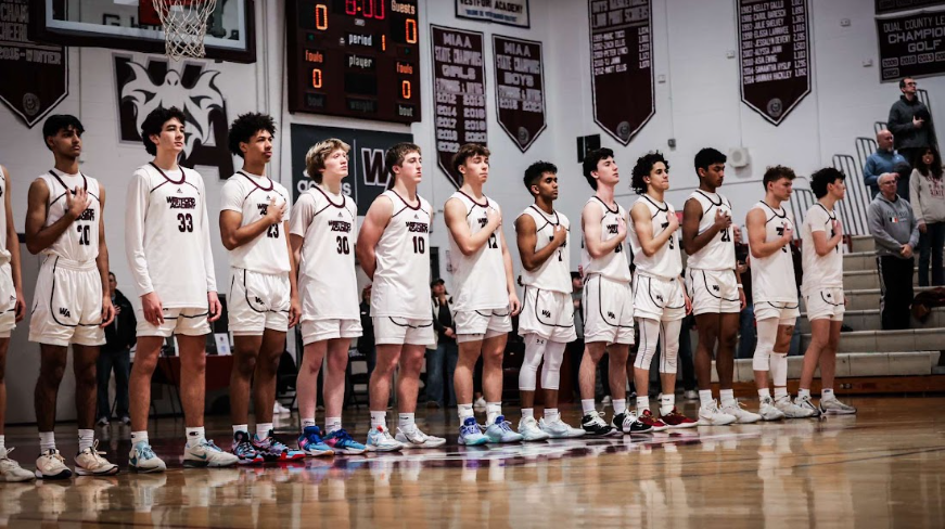 WA Boys Basketball lines up for the National Anthem.