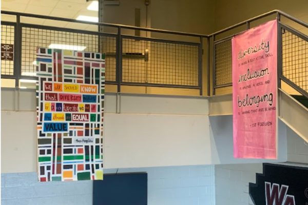 Banners on equality and inclusion hang on the senior lobby stairs.