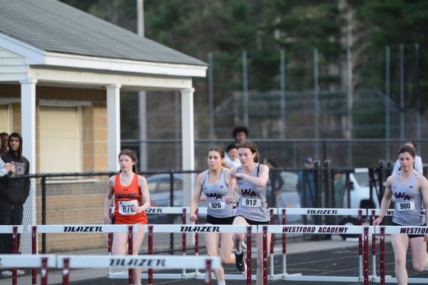The WA Girls Track members go head to head against Wayland in the 100M hurdles. 