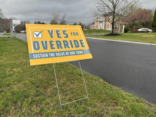 A sign advocating for people to vote for the override in one of Westfords many neighborhoods. 