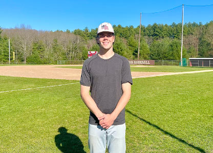 Jake Cullen standing in front of his school baseball field