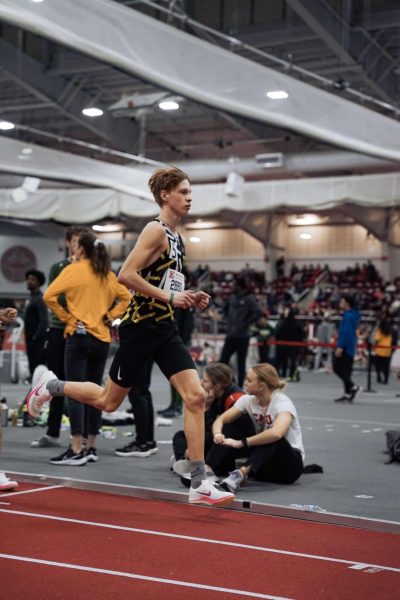 Jack Graffeo sprints to the finish line in an indoor track meet. 