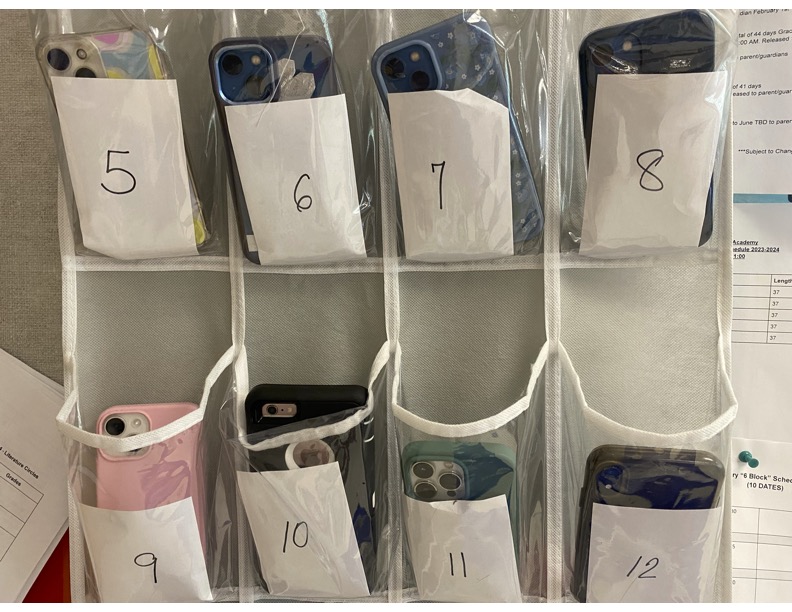 Students must place their phones in caddies when class begins and cannot access it again until the bell rings